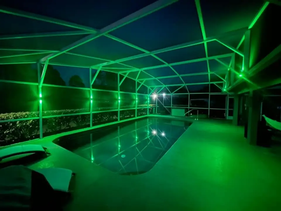Color: a screen-enclosed pool with color-capable lighting